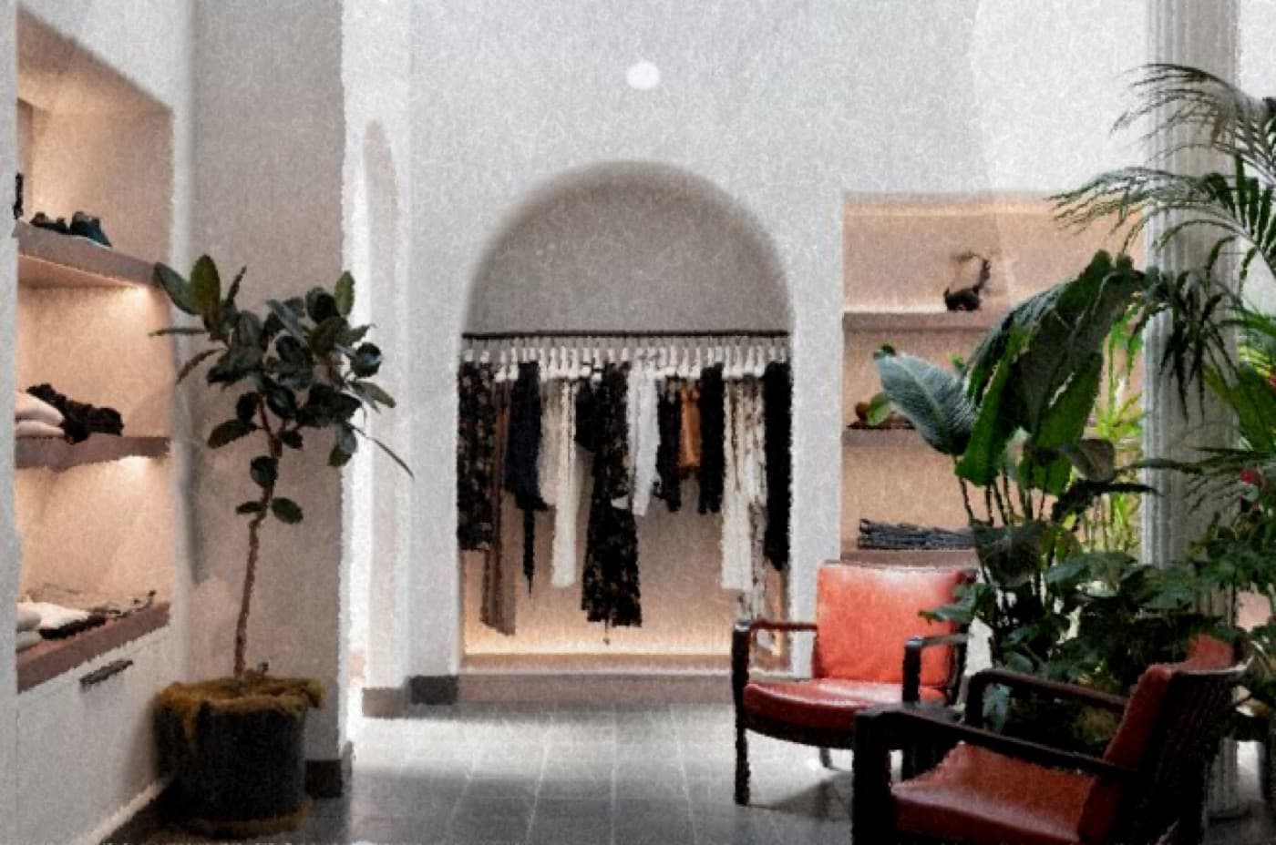 A.L.C.'s boutique: arched white walls, racks of contemporary fashion